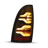 AlphaRex 05-15 Toyota Tacoma LUXX LED Taillights Alpha Blk w/Activ Light/Seq Signal - 680050