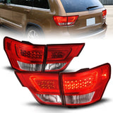 ANZO 11-13 Jeep Grand Cherokee LED Taillights w/ Lightbar Chrome Housing Red/Clear Lens 4pcs - 311442